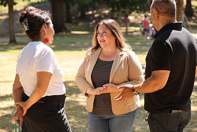 Carmen Rubio with adults in a park